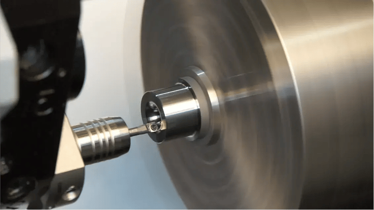 Diamond tooling in action during a precision turning operation, showcasing advanced machining capabilities.