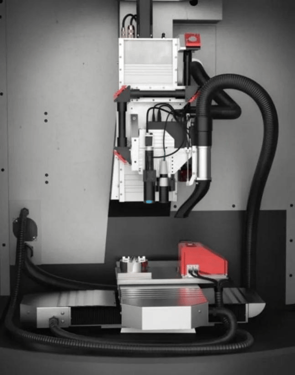 Interior view of Kern Femto laser machining system showing advanced automation and adaptive machining components.
